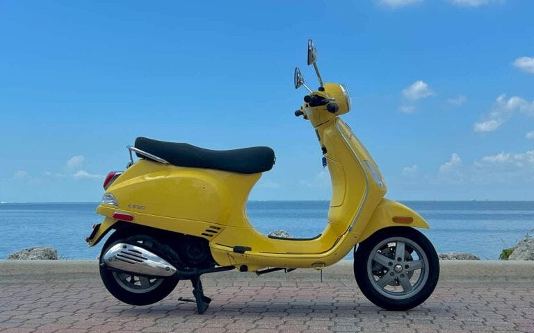 rent-a-vespa-lx-50cc-motorcycle-yellow